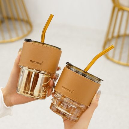 Sip in style with our 420/450ml coffee glass cup with leather cover – comes with straw lid – perfect for water, milk, tea, and more