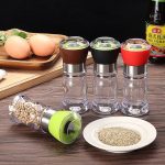 Add flavor to your dishes with our manual salt and pepper mill grinder – essential kitchen gadget for convenient seasoning