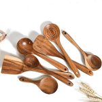 Natural wood kitchen utensil set with spoon, ladle, turner, colander, and skimmer in a storage box